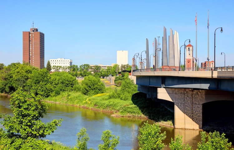 The green areas, river, and bridge found in Fargo, ND